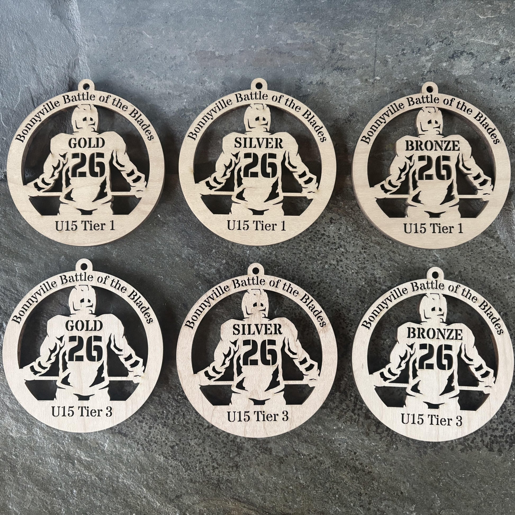Custom laser-cut wooden hockey medals – Bonnyville tournament | Ornemoi
